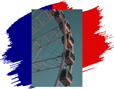 A ferris wheel with the french flag in the background.